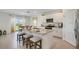 Modern kitchen featuring a large island, stainless steel appliances, and granite countertops at 1778 Three Bars Rd, Kissimmee, FL 34744