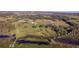 Aerial view showing expansive property with a lake and dock at 3140 Friars Cove Rd, Saint Cloud, FL 34772