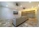 Finished basement with a comfortable lounge area and shelving at 3140 Friars Cove Rd, Saint Cloud, FL 34772