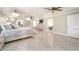 Bright main bedroom with large bed and access to the bathroom at 3140 Friars Cove Rd, Saint Cloud, FL 34772