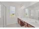 Double vanity bathroom with a large mirror and shower at 4481 Monado Dr, Kissimmee, FL 34746