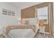 Bedroom with a king-size bed and neutral color palette at 4481 Monado Dr, Kissimmee, FL 34746