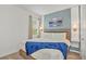 Main bedroom with a modern bed frame and a blue blanket at 4481 Monado Dr, Kissimmee, FL 34746