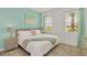 Bedroom with a king-size bed, light walls, and teal accents at 4481 Monado Dr, Kissimmee, FL 34746