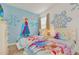 Charming bedroom with twin beds and Frozen theme at 4481 Monado Dr, Kissimmee, FL 34746