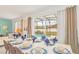 Dining room with a large table, chairs, and blue napkins at 4481 Monado Dr, Kissimmee, FL 34746