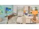 Living room with a white sectional sofa, light wood furniture, and a large TV at 4481 Monado Dr, Kissimmee, FL 34746