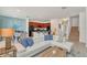 Open floorplan with a white sectional sofa and a view of the kitchen and dining area at 4481 Monado Dr, Kissimmee, FL 34746