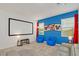 Home theater with projector screen and comfy seating at 4481 Monado Dr, Kissimmee, FL 34746