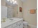 Clean bathroom with a white vanity, toilet and shower at 8336 Riverdale Ln, Davenport, FL 33896