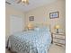King-size bedroom with geometric bedding and a ceiling fan at 8336 Riverdale Ln, Davenport, FL 33896