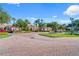 Attractive community entrance with fountain and landscaping at 8336 Riverdale Ln, Davenport, FL 33896