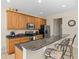 Well-equipped kitchen featuring granite countertops and ample cabinetry at 8336 Riverdale Ln, Davenport, FL 33896