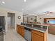 Kitchen with granite island, stainless steel appliances, and breakfast bar at 8336 Riverdale Ln, Davenport, FL 33896