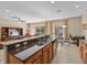 Open concept kitchen with breakfast bar and views to the living room at 8336 Riverdale Ln, Davenport, FL 33896