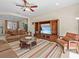 Living room featuring comfortable seating, a large TV, and a cozy atmosphere at 8336 Riverdale Ln, Davenport, FL 33896