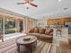 Bright living room with sliding glass doors leading to a patio or backyard at 8336 Riverdale Ln, Davenport, FL 33896