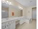 Double vanity bathroom with soaking tub and separate shower at 8336 Riverdale Ln, Davenport, FL 33896