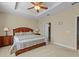 Main bedroom with king-size bed and ceiling fan at 8336 Riverdale Ln, Davenport, FL 33896