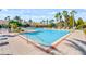 Relaxing community pool with plenty of lounge chairs at 8336 Riverdale Ln, Davenport, FL 33896