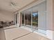 Screened porch with sliding doors leading to the backyard at 8336 Riverdale Ln, Davenport, FL 33896