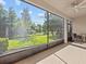 Screened porch with view of grassy backyard at 8336 Riverdale Ln, Davenport, FL 33896