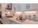 Kitchen countertop with a gas cooktop, white tile backsplash, and modern fixtures at 851 Arbor Green Trl, St Cloud, FL 34771