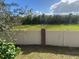 View of a fenced backyard with open grassy area at 912 Hire Cir, Ocoee, FL 34761