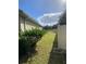 Side yard view showing a grassy area and fence at 912 Hire Cir, Ocoee, FL 34761
