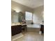 Large Primary bathroom with a corner bathtub and double vanity at 912 Hire Cir, Ocoee, FL 34761