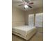 Main bedroom with a king-size bed and ceiling fan at 912 Hire Cir, Ocoee, FL 34761