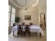 Formal dining room featuring a large table and elegant light fixture at 912 Hire Cir, Ocoee, FL 34761