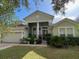 Attractive two-story house with a manicured lawn and a large front porch at 912 Hire Cir, Ocoee, FL 34761