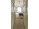 Hallway leading to the bedrooms with double door closets on each side at 912 Hire Cir, Ocoee, FL 34761