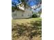 Two-story house with backyard and partial view of trees at 912 Hire Cir, Ocoee, FL 34761