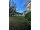 House backyard with partial view of trees and fence at 912 Hire Cir, Ocoee, FL 34761