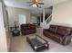 Relaxing living room with two leather sofas at 912 Hire Cir, Ocoee, FL 34761