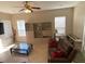 Living room with built-in shelving and large windows at 912 Hire Cir, Ocoee, FL 34761