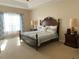 Spacious main bedroom with a king-size bed and large windows at 912 Hire Cir, Ocoee, FL 34761