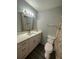 Bathroom with white vanity, a toilet and shower/tub combo at 1023 S Hiawassee Rd # 4022, Orlando, FL 32835