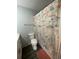 Bathroom with nautical-themed shower curtain and modern vanity at 1023 S Hiawassee Rd # 4022, Orlando, FL 32835