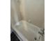 Simple bathroom with a bathtub and tiled walls at 1023 S Hiawassee Rd # 4022, Orlando, FL 32835
