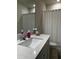 Clean bathroom with white vanity, shower, and updated fixtures at 1023 S Hiawassee Rd # 4022, Orlando, FL 32835