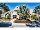 Attractive community building with landscaping and palm trees at 1023 S Hiawassee Rd # 4022, Orlando, FL 32835
