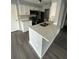 Updated kitchen with white shaker cabinets and quartz counters at 1023 S Hiawassee Rd # 4022, Orlando, FL 32835