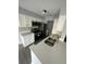 Modern kitchen featuring stainless steel appliances and white cabinets at 1023 S Hiawassee Rd # 4022, Orlando, FL 32835