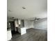 Open concept kitchen and living area with gray walls at 1023 S Hiawassee Rd # 4022, Orlando, FL 32835