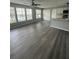 Spacious living room with gray vinyl plank flooring at 1023 S Hiawassee Rd # 4022, Orlando, FL 32835