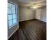 Bright living room with wood-look floors and a ceiling fan at 1023 S Hiawassee Rd # 4022, Orlando, FL 32835