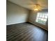 Living room featuring wood-look floors and a window at 1023 S Hiawassee Rd # 4022, Orlando, FL 32835